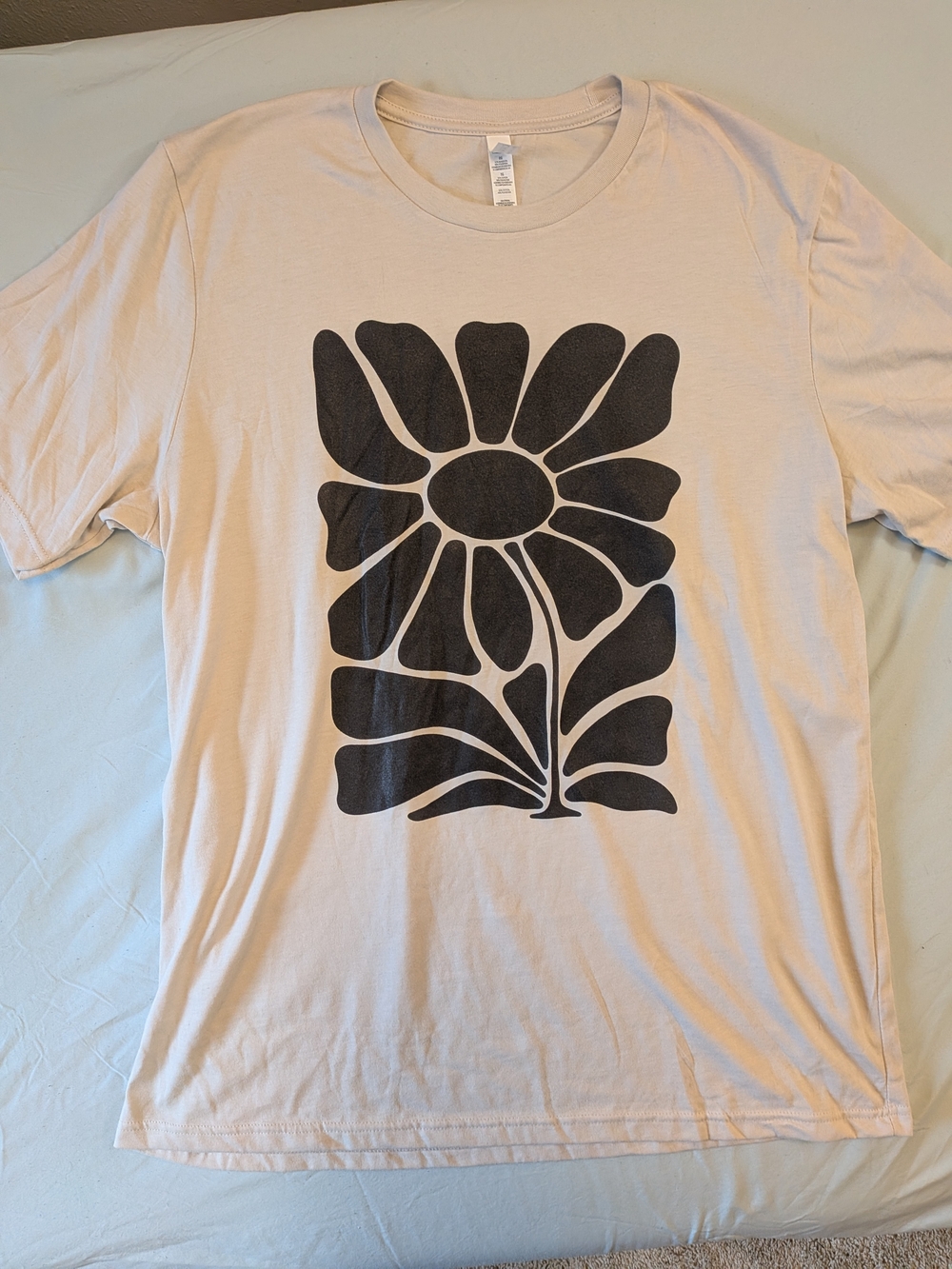 Bella Canvas Cream T-Shirt with Black Floral Graphic